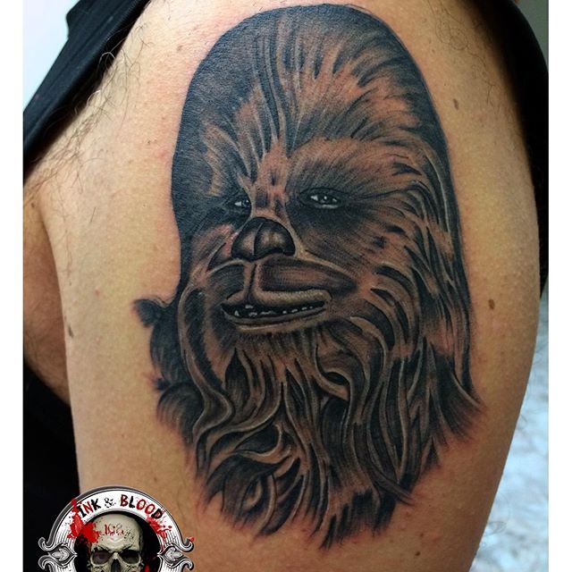 Black And Grey Chewbacca Tattoo On Left Shoulder