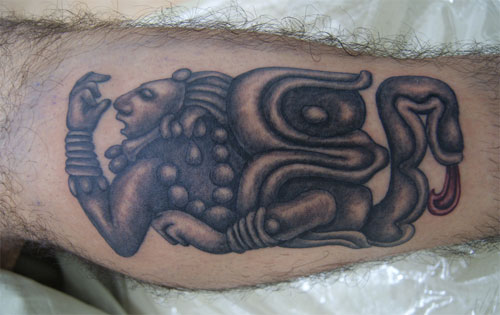 Black And Grey Ink Mayan Tattoo On Side Leg