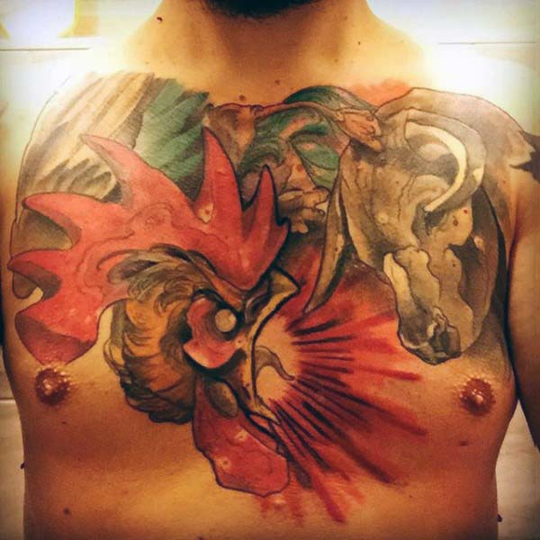 Bull And Rooster Fighting Tattoo On Man Chest.