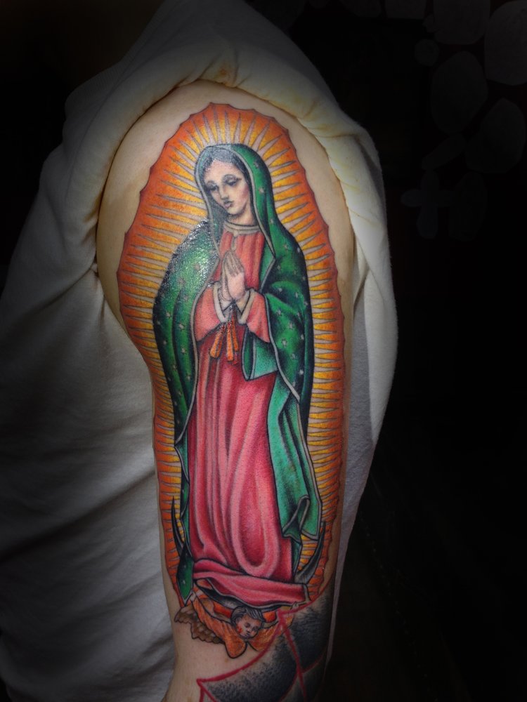 Colored Virgin Mary Tattoo On Left Half Sleeve.
