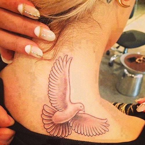 Cute White Ink Flying Dove Tattoo On Upper Back