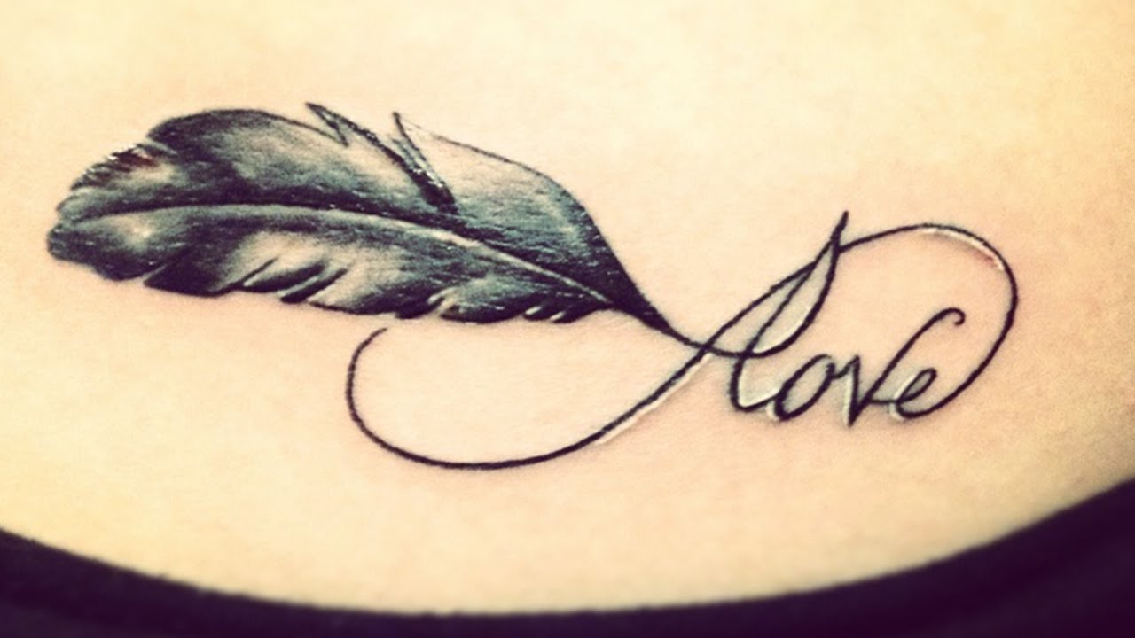 Feather And Love Infinity Tattoo On Lower Back