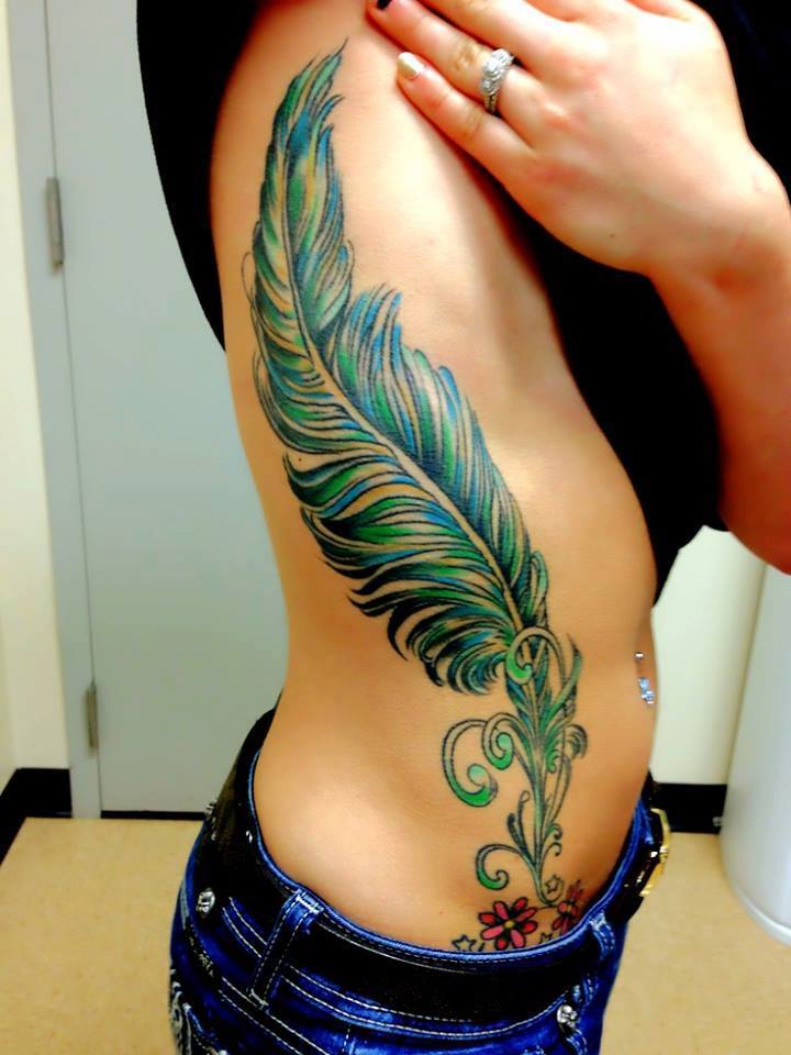 Green Ink Feather Tattoo On Side Rib