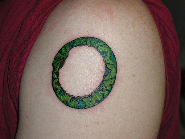 Green Ink Ouroboros Tattoo On Left Shoulder