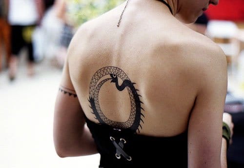 Grey And Black Ouroboros Tattoo On Upper Back