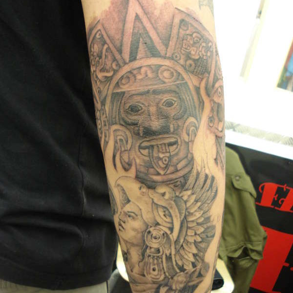 Grey And White Mayan Tattoo On Left Sleeve