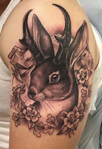 Grey Flowers And Jackalope Tattoo On Left Shoulder