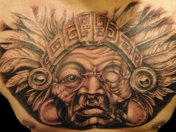 Grey Ink Mayan Tattoo On Man Chest