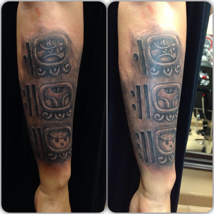 Grey Ink Mayan Tattoo On Right Arm For Men