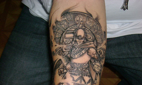 Grey Ink Mayan Tattoo On Right Forearm