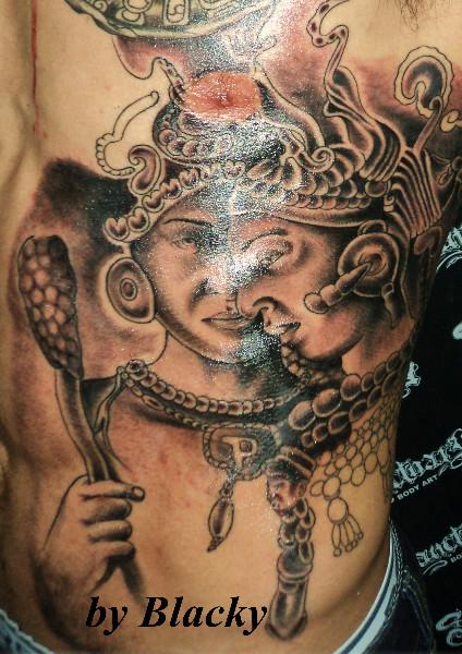 Grey Ink Mayan Tattoo On Side Rib by Blacky