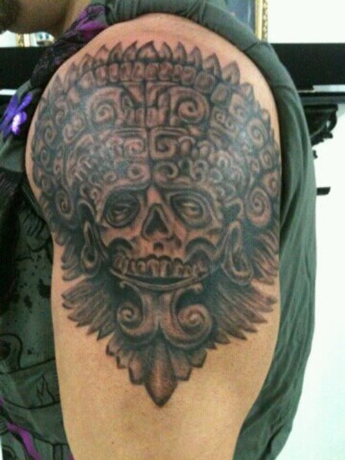 Grey Ink Mayan Warrior Skull Tattoo On Shoulder