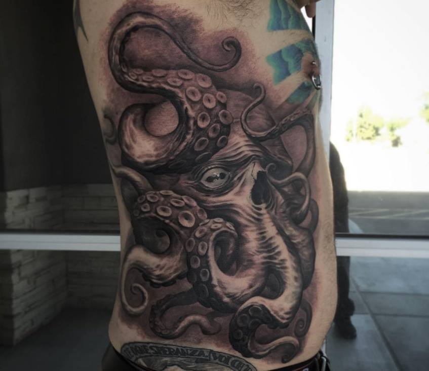 Grey Ink Octopus Tattoo On Side Rib