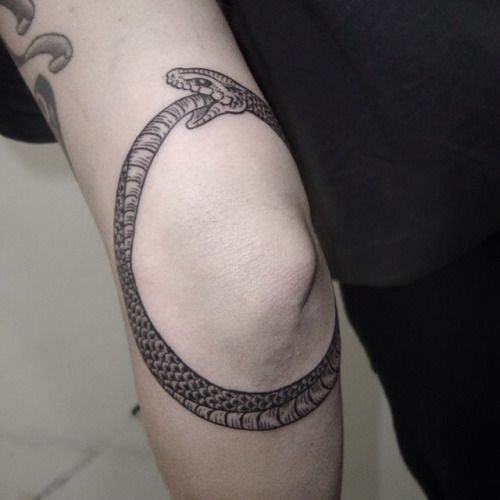 Grey Ink Ouroboros Tattoo On Left Elbow