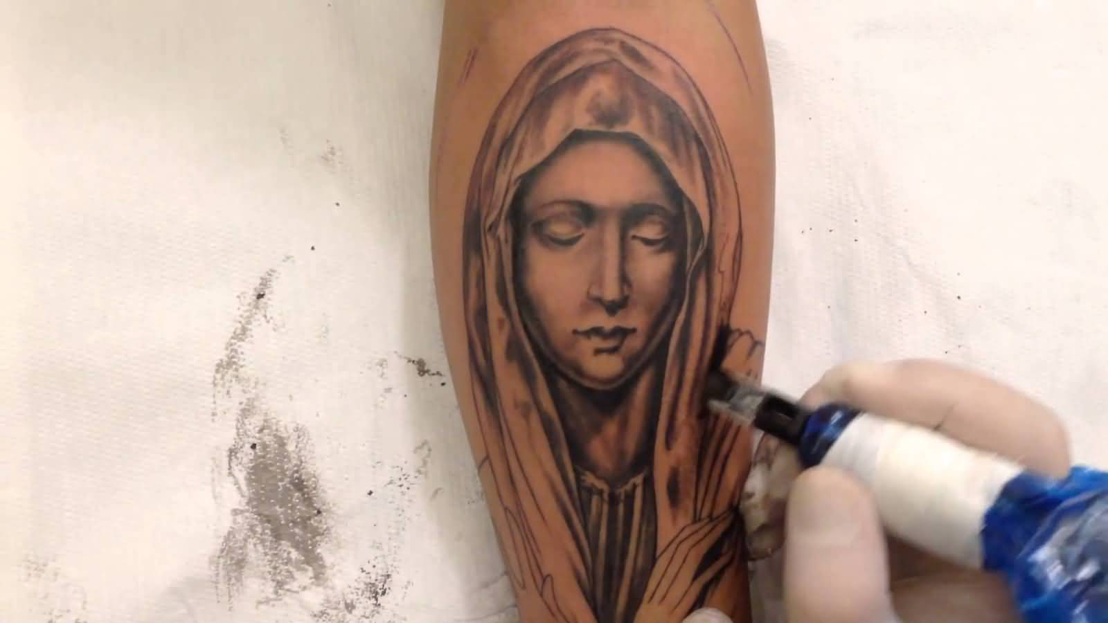 Nice Grey Ink Virgin Mary Tattoo On Leg