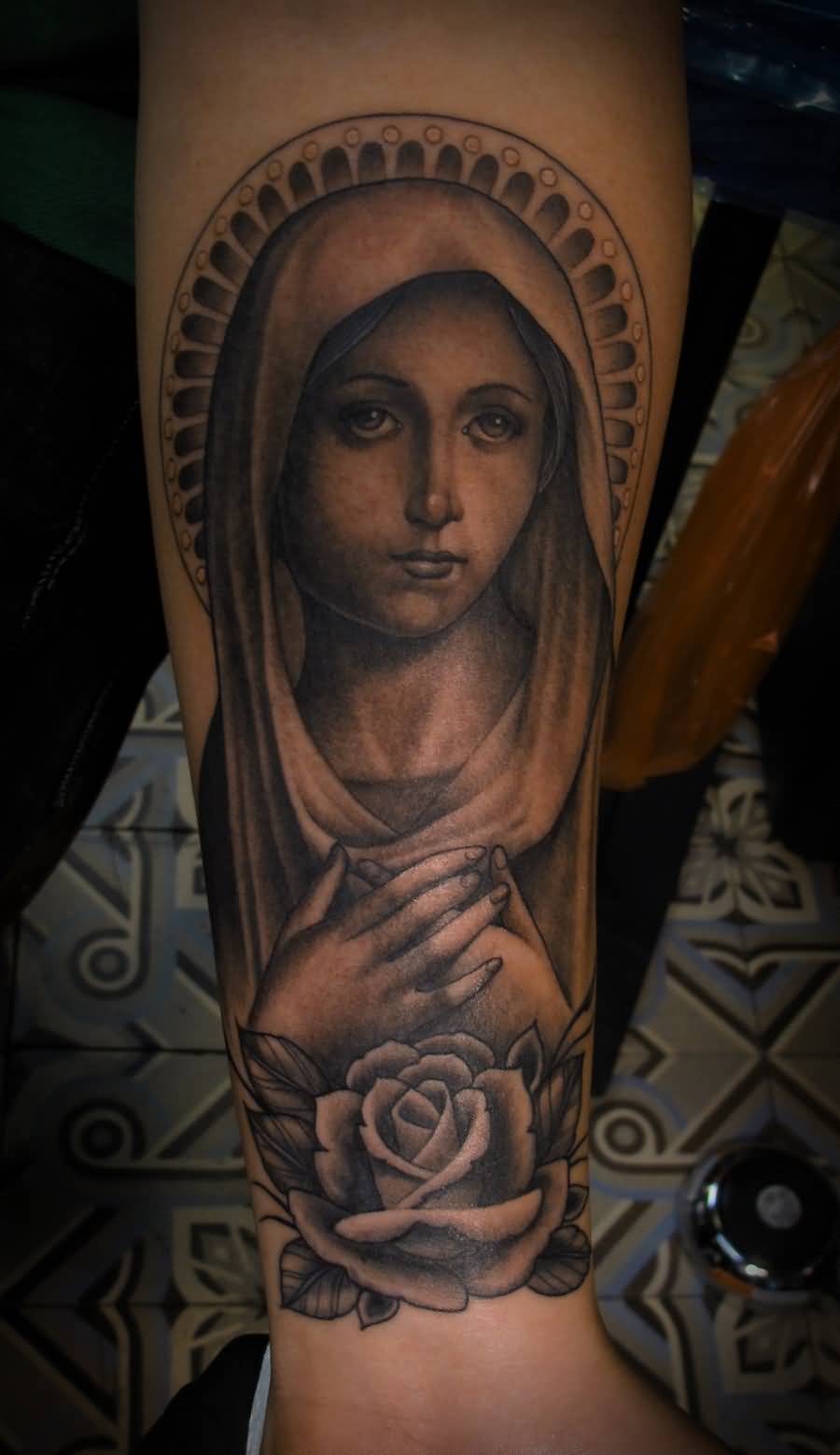 Nice Grey Rose And Virgin Mary Tattoo On Forearm