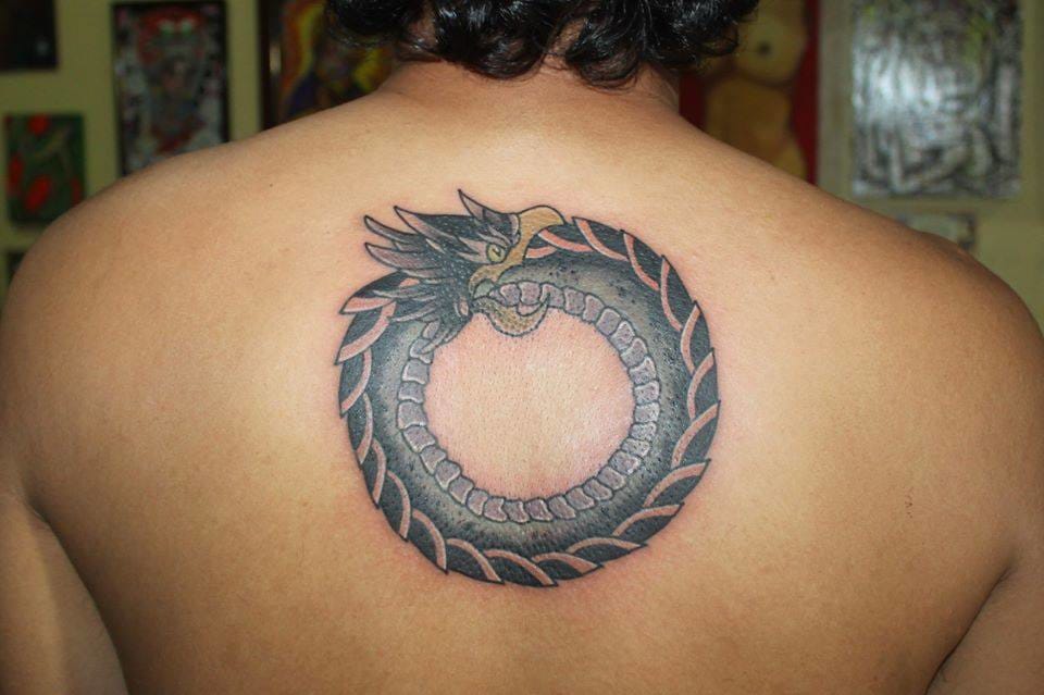 Ouroboros Tattoo On Girl Upper Back by Ryan Calleja