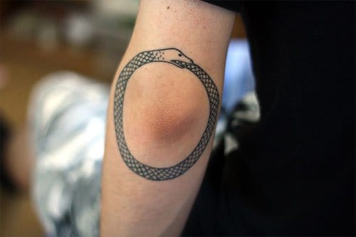 Ouroboros Tattoo On Left Elbow