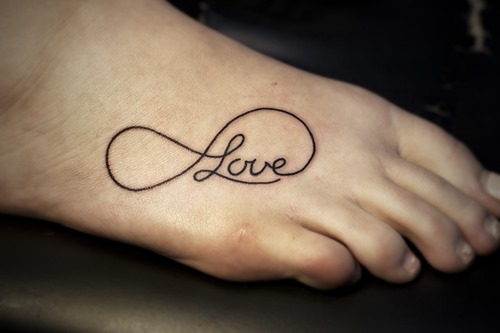 Outline Love Infinity Tattoo On Right Foot