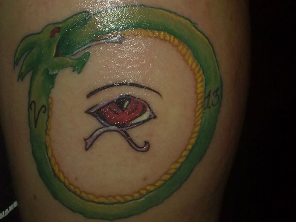 Red Eye Green Ouroboros Tattoo