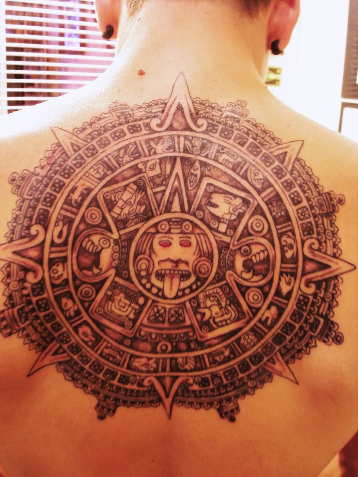 Red Eyes Mayan Tattoo On Upper Back