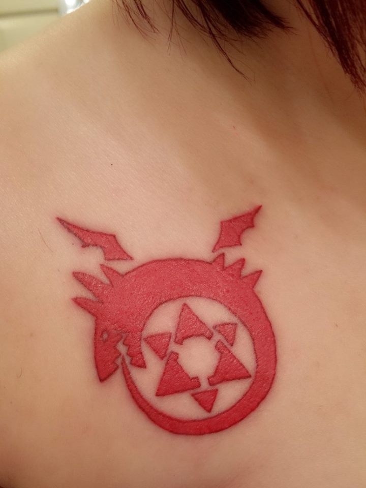 Red Ouroboros Tattoo On Front Shoulder