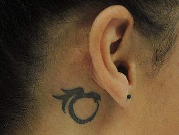 Small Ouroboros Tattoo Behind The Ear