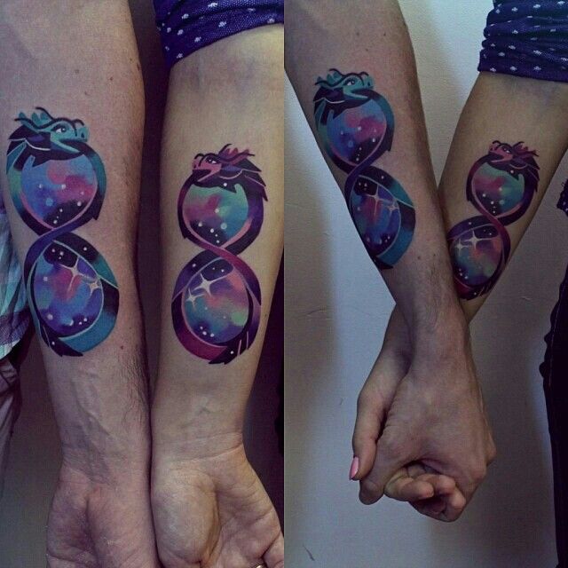 Watercolor Ouroboros Tattoos On Forearm