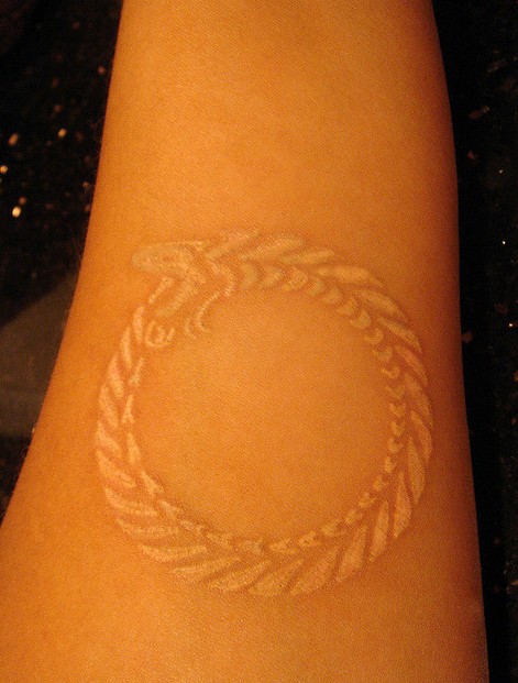 White Ink Ouroboros Tattoo On Forearm