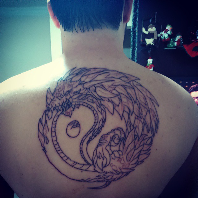 Yin Yang Ouroboros Tattoo On Man Upper Back by Taglas