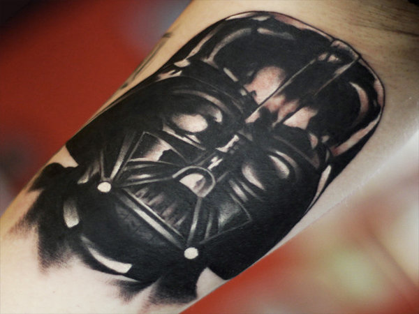 Black Ink Darth Vader Head Tattoo On Bicep
