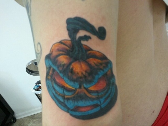 Blue Evil Pumpkin Tattoo On Left Bicep