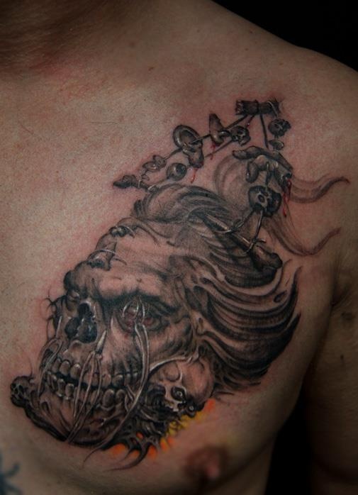 Demon Shrunken Head Tattoo On Man Chest
