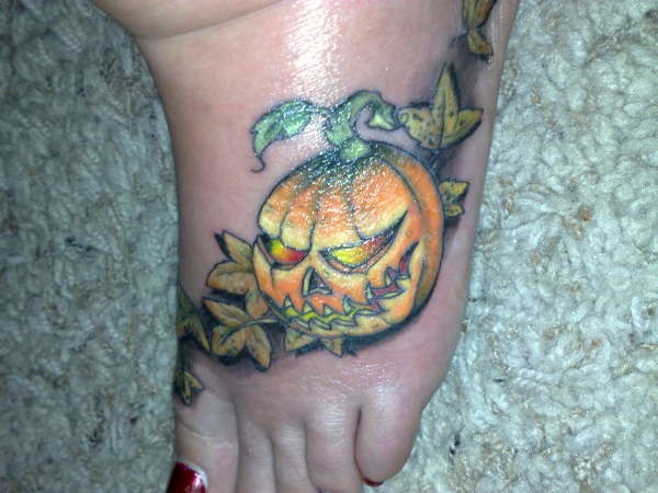 Evil Pumpkin Tattoo On Girl Left Foot