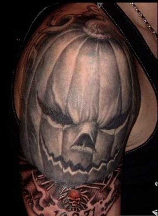 Evil Pumpkin Tattoo On Right Shoulder