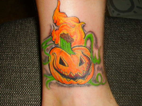Flaming Evil Pumpkin Tattoo On Ankle