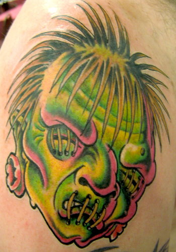 Green Ink Jason Shrunken Head Tattoo