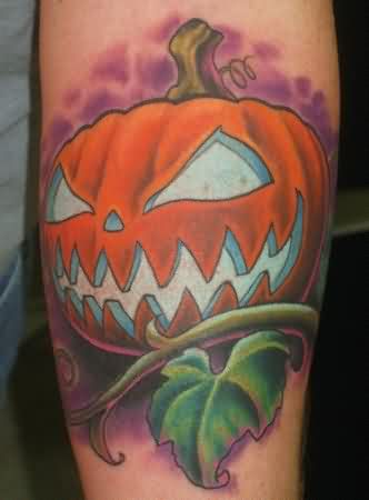Green Leaves Evil Pumpkin Tattoo On Arm