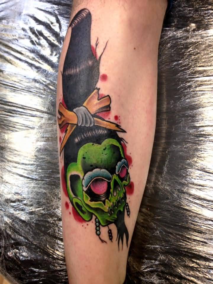 Green Shrunken Head Tattoo On Leg by Holly