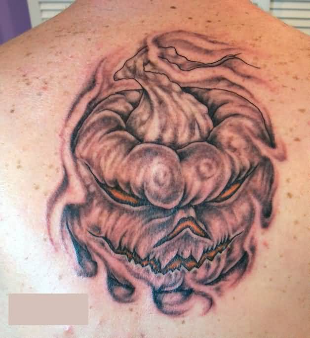 Grey Ink Evil Pumpkin Tattoo On Upper Back