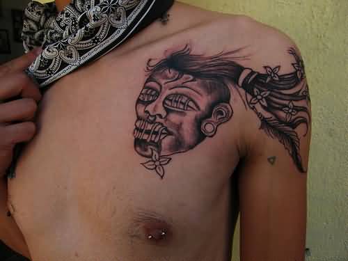 Grey Ink Shrunken Head Tattoo On Front Shoulder