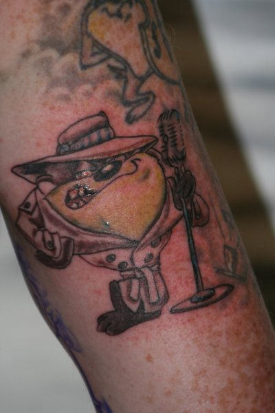 Microphone And Gangster Taz Tattoo On Leg