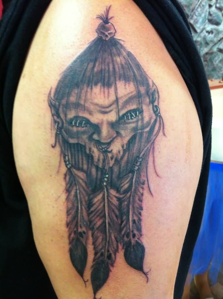 Native Shrunken Head Tattoo On Left Half Sleeve