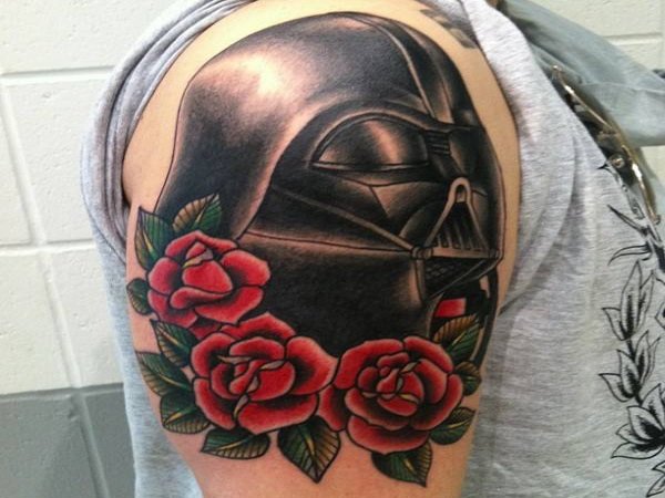 Red Rose Flowers And Darth Vader Tattoo On Shoulder