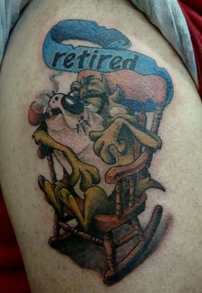 Retired Banner And Taz Tattoo On Shoulder