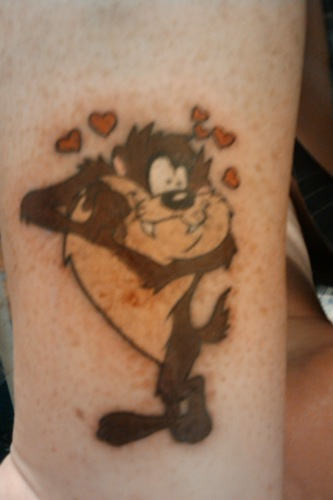 Tiny Red Hearts And Loveable Taz Tattoo
