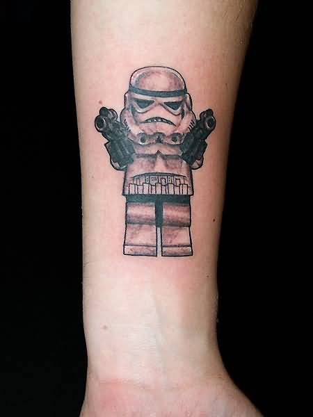 Black And Grey Lego Stormtrooper Tattoo On Forearm
