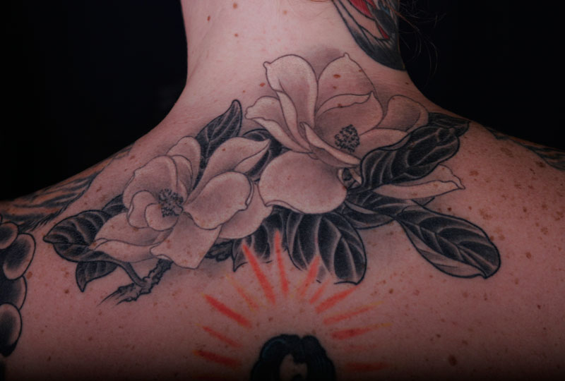 Black And White Magnolia Flower Tattoos On Upper Back