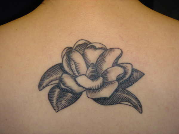 Black And White Magnolia Tattoo On Upper Back