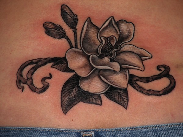 Grey Ink Magnolia Flower Tattoo On Lower Back